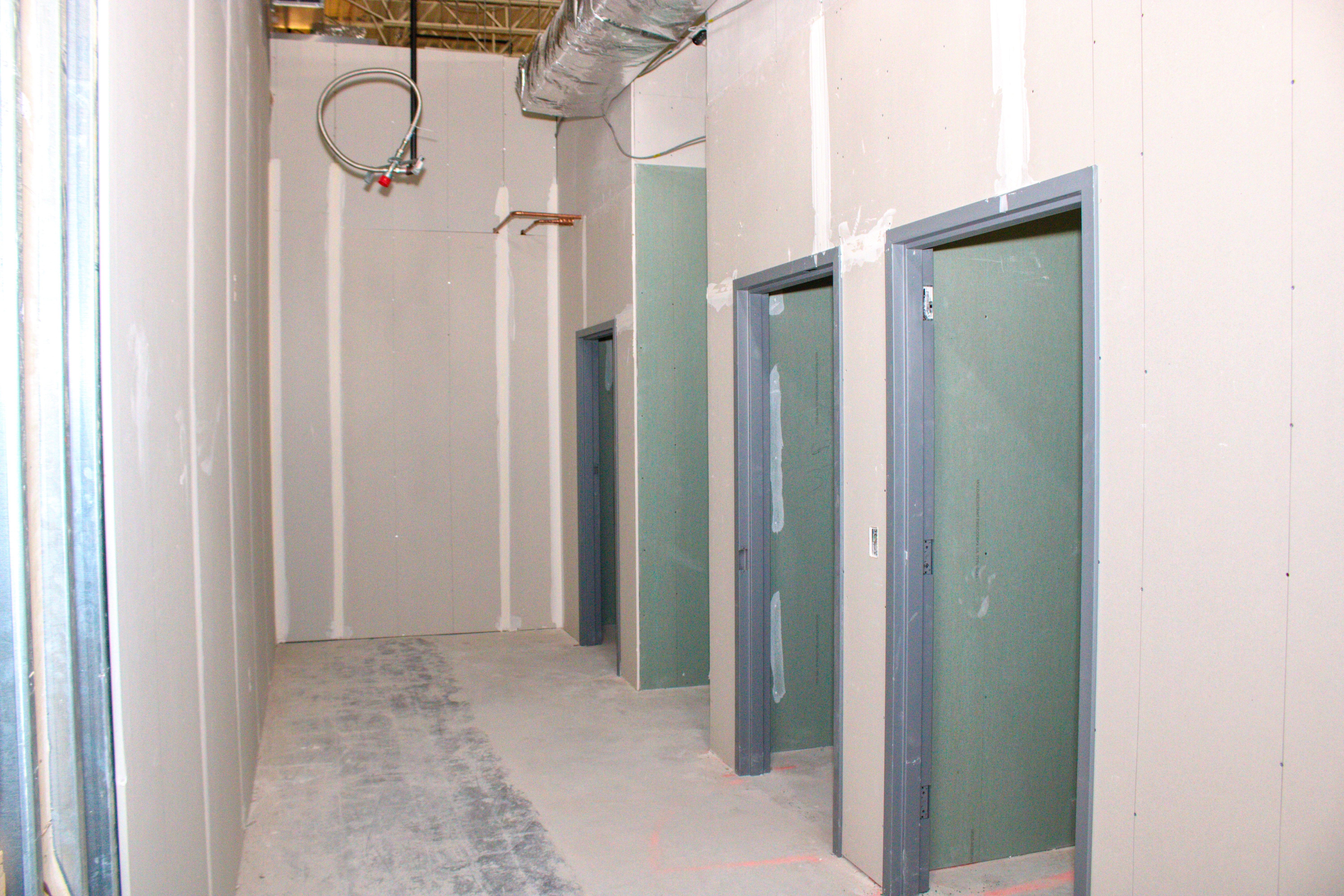 Corridor-with-Rec-Bathrooms-and-Janitor-Storage-in-Middle