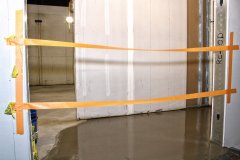 Self-Leveling-Floor-poured-by-back-gym-exit-with-Fitness-Center-in-background