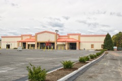 Exterior-of-Bulding-with-Christmas-Tree-and-Planters